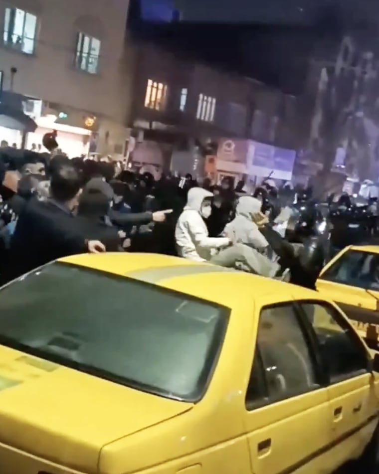Protesters are seen fighting security forces in Urmia, Iran, in a video that circulated on social media on Monday.