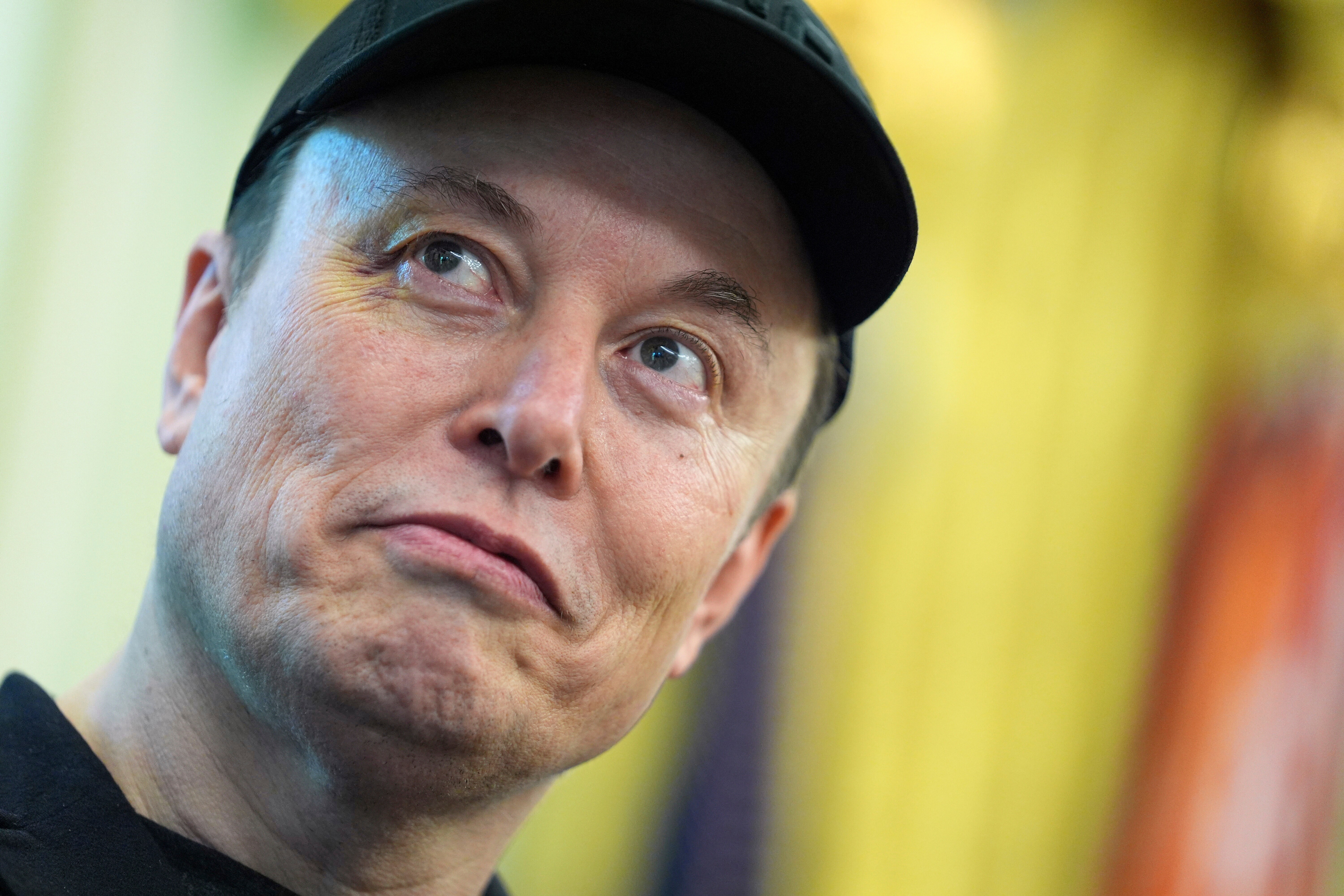 FILE - Elon Musk listens as President Donald Trump speaks during a news conference in the Oval Office of the White House, May 30, 2025, in Washington.