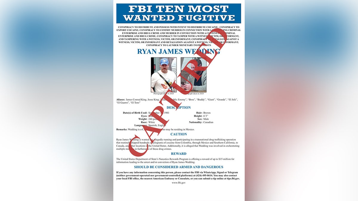 An FBI wanted poster with "captured" across it in red letters