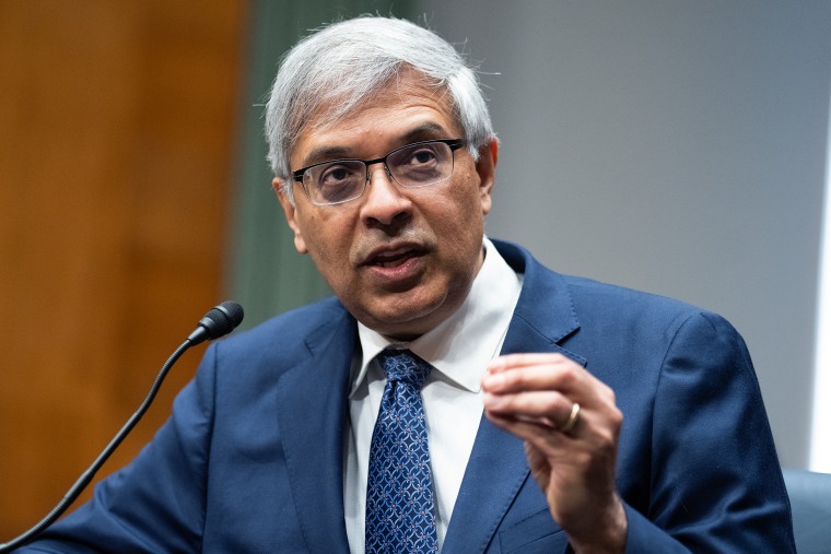 Jay Bhattacharya gestures with his left hand while speaking into a microphone during a Congressional hearing.