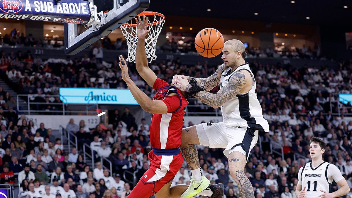 Duncan Powell fouls Bryce Hopkins