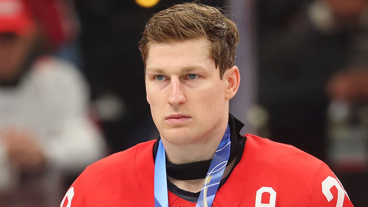 Nathan MacKinnon looks on ice