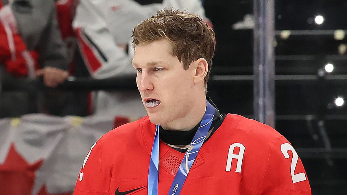 Nathan MacKinnon looks on ice