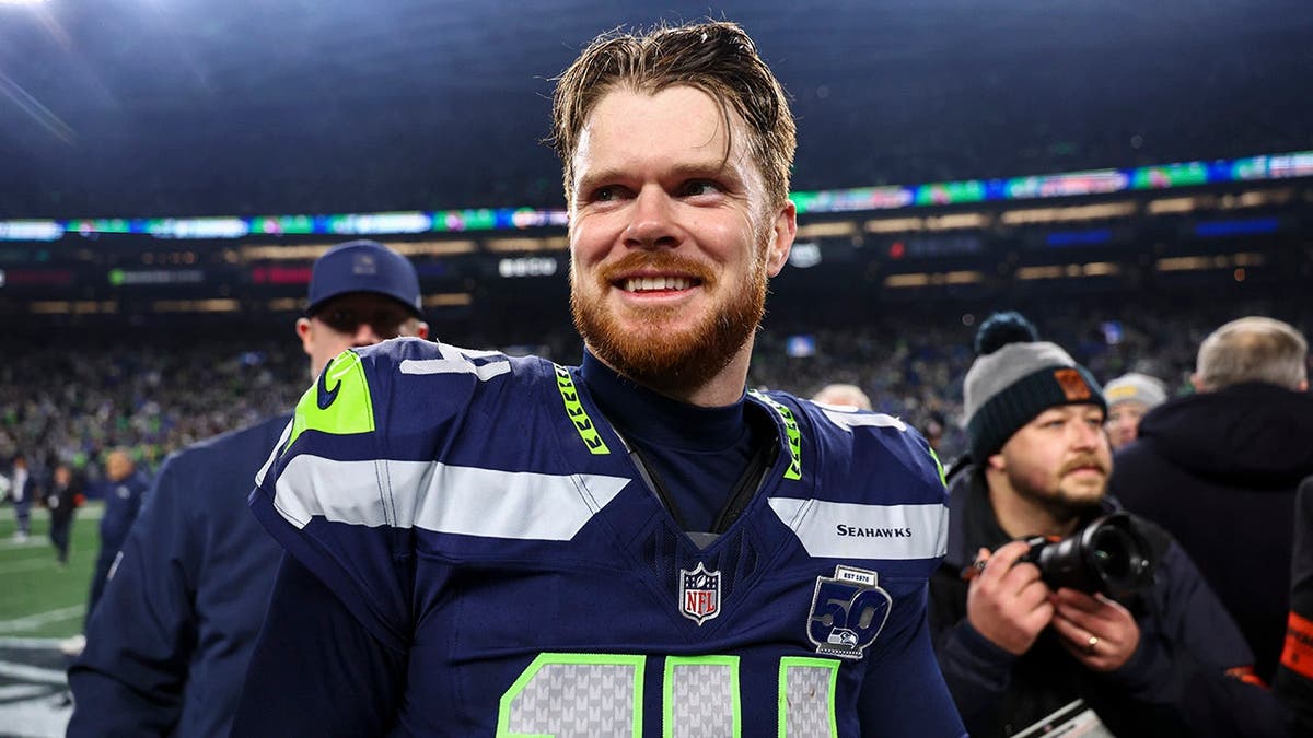Sam Darnold smiles on field