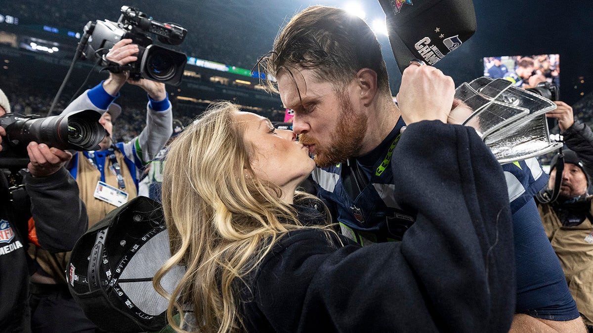 Sam Darnold and Katie Hoofnagle embrace