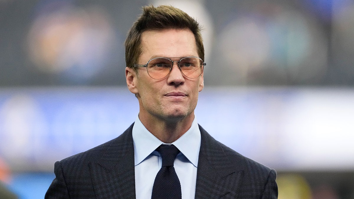 Tom Brady looks on