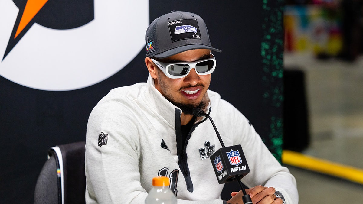 Jaxon Smith-Njigba smiles at podium