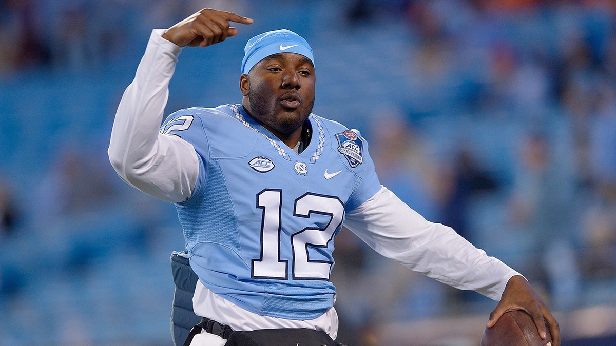 Marquise Williams warms up before a college football game