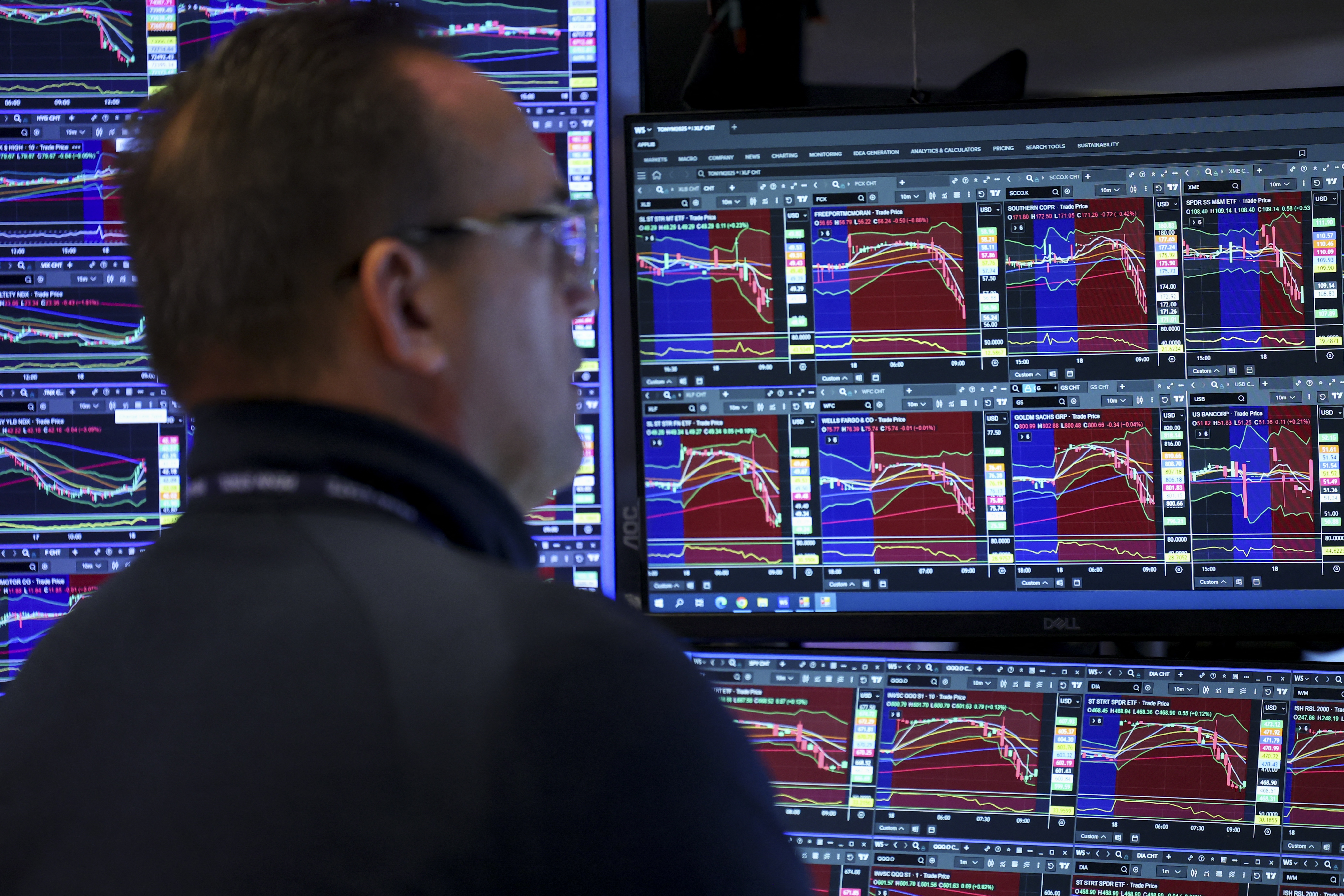 A trader works on the floor of the New York Stock Exchange at the opening bell in New York on Wednesday.