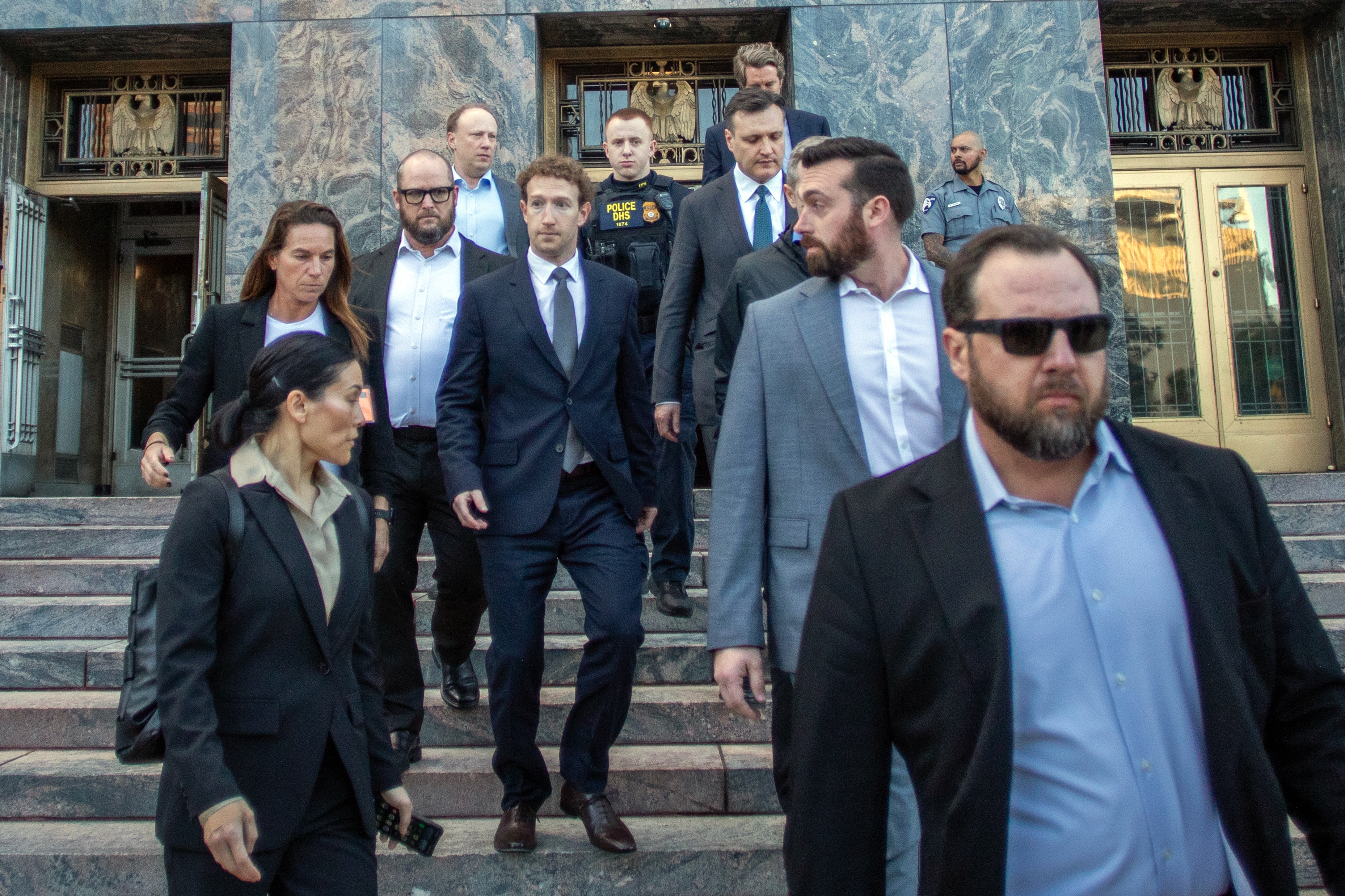 Meta CEO Mark Zuckerberg, center, leaves the Los Angeles Superior Court after testifying in the social media trial tasked to determine whether social media giants deliberately designed their platforms to be addictive to children, in Los Angeles, on Feb. 18, 2026.