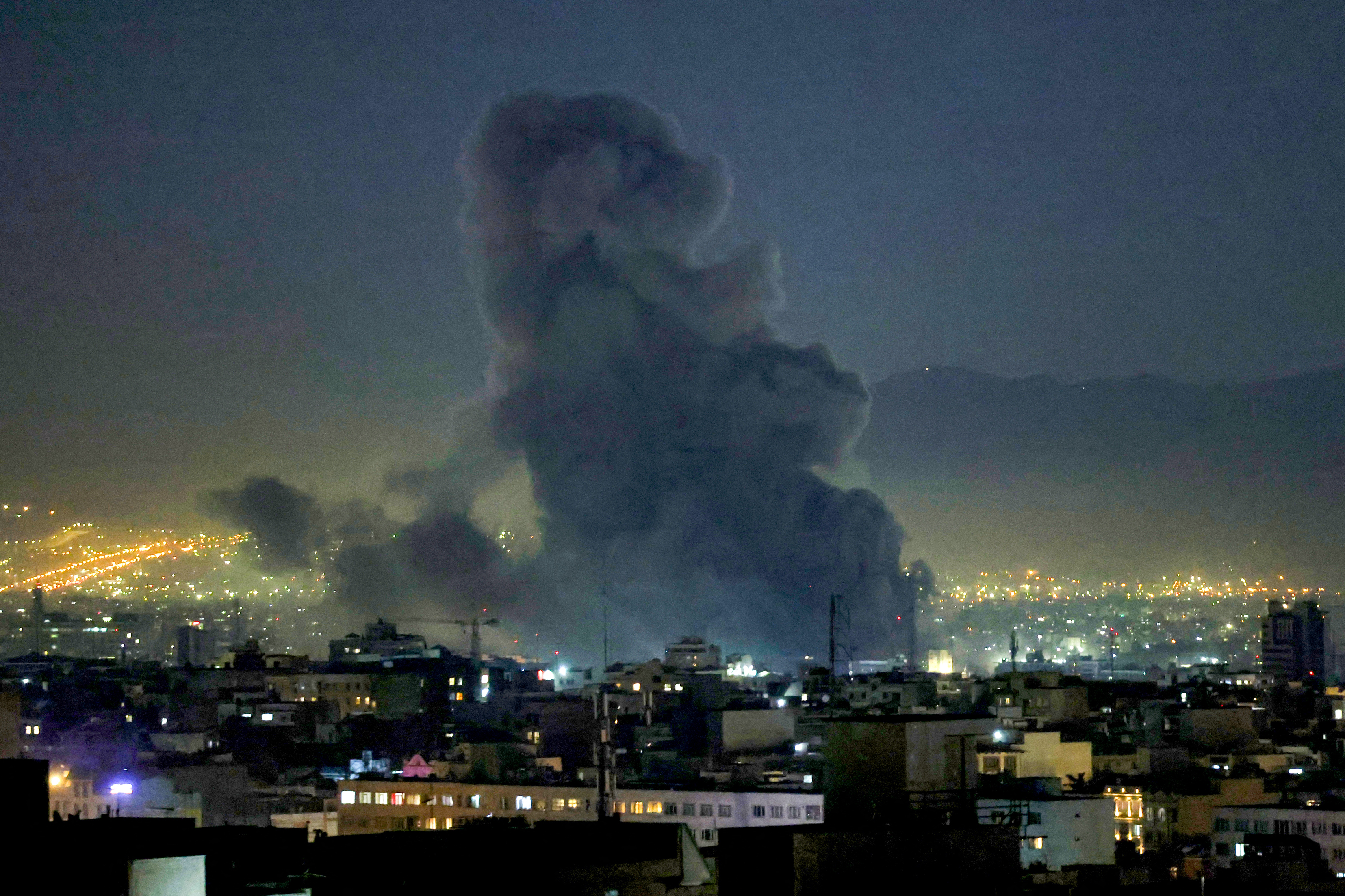 Smoke plumes rise following missile strikes in Tehran on March 1, 2026. The United States and Israel launched strikes against Iran on February 28, killing Iran