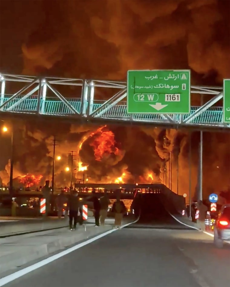 The fiery aftermath of an airstrike on an oil depot in northeast Tehran in a still from a video shared on social media Sunday and verified by NBC News.