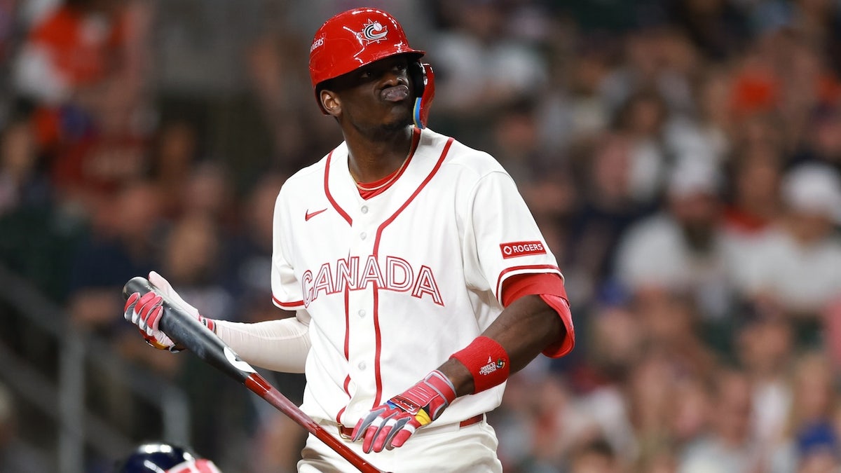 Denzel Clarke #1 of Team Canada reacts after striking out during the fifth inning against Team United States at Daikin Park on March 13, 2026, in Houston, Texas.