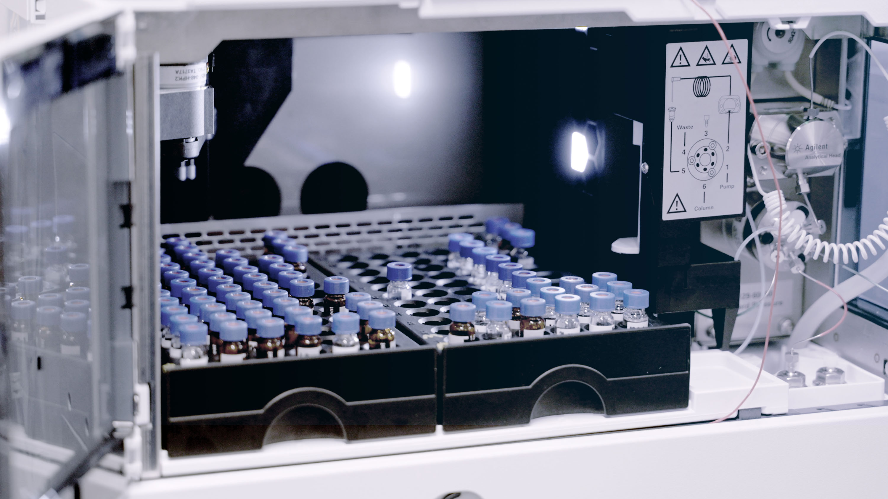 vials of electrolytes inside a machine at the synthesis foundry