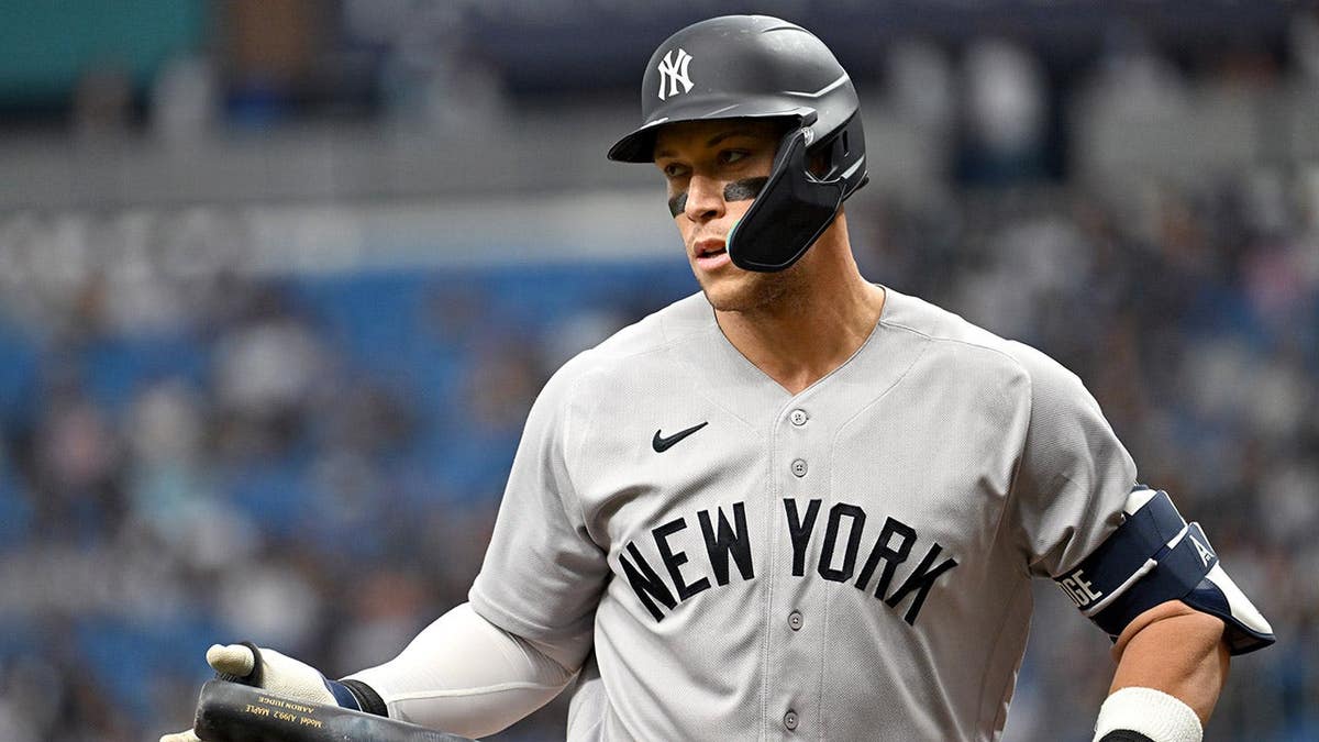 New York Yankees Aaron Judge walking to dugout after striking out during baseball game