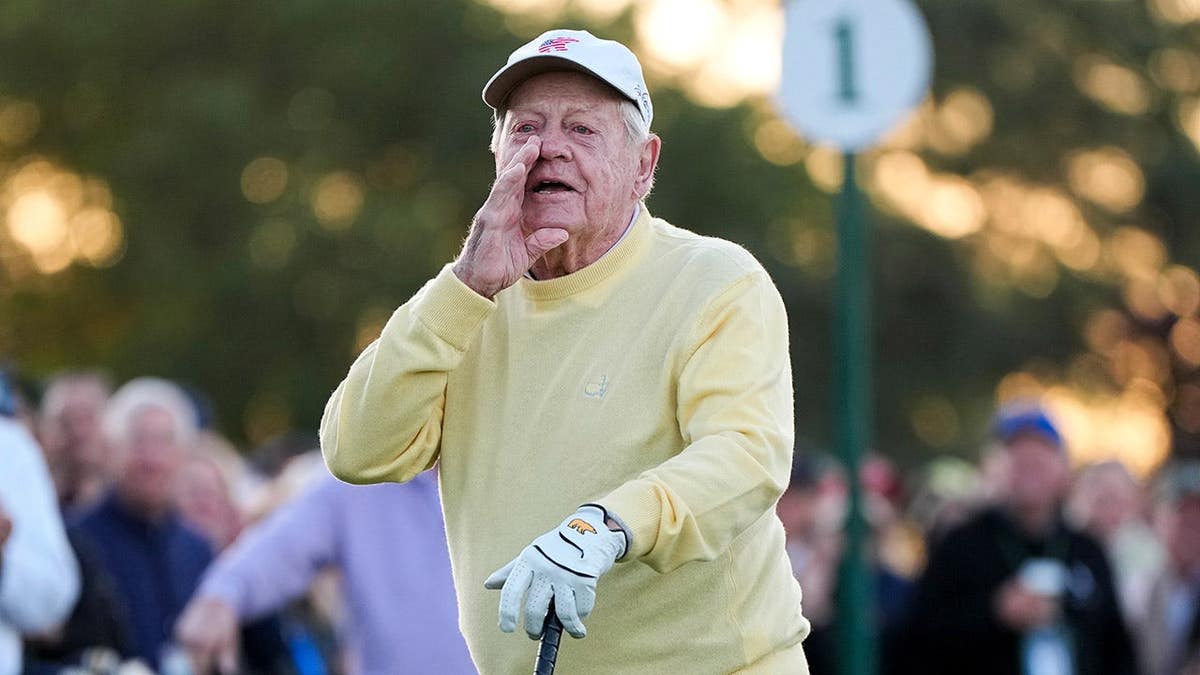 Jack Nicklaus hitting a ceremonial tee shot on the first hole at Augusta National Golf Club