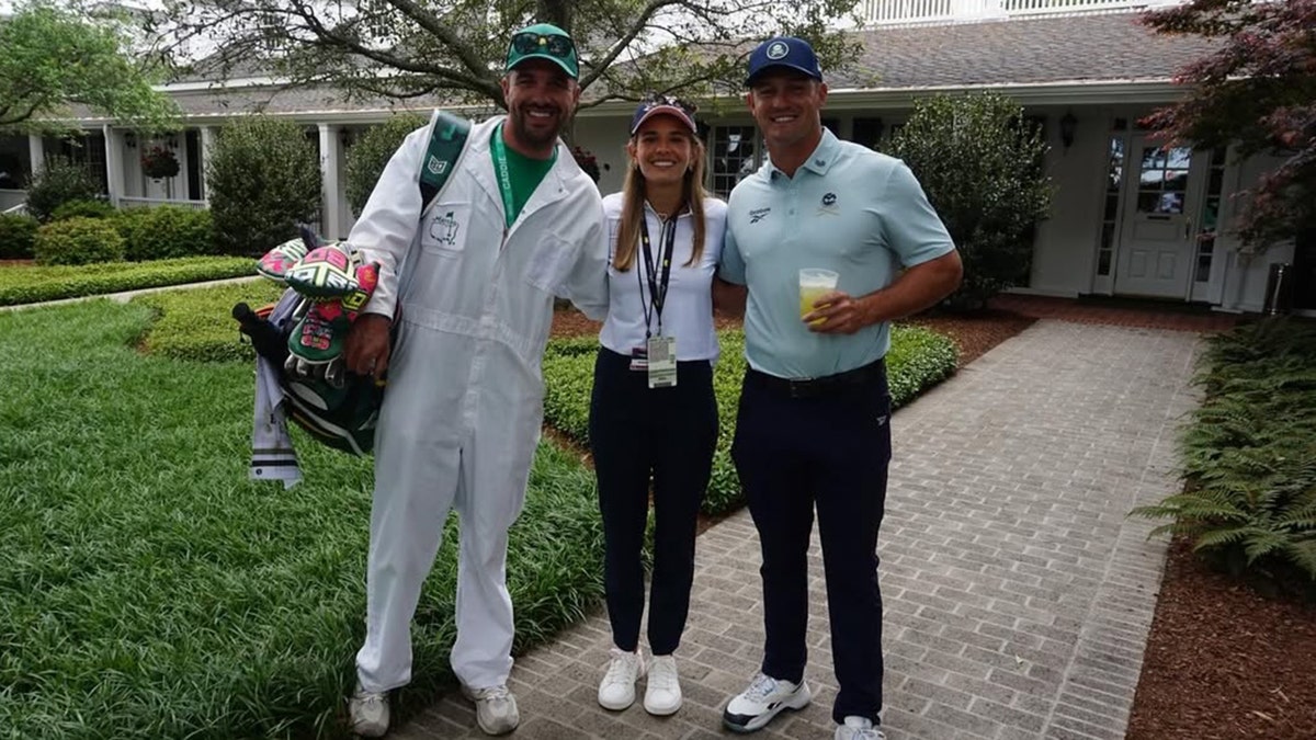Kai Trump takes a photo with Bryson DeChambeau