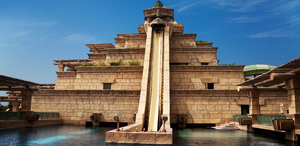 An ancient structure slide and a pool.