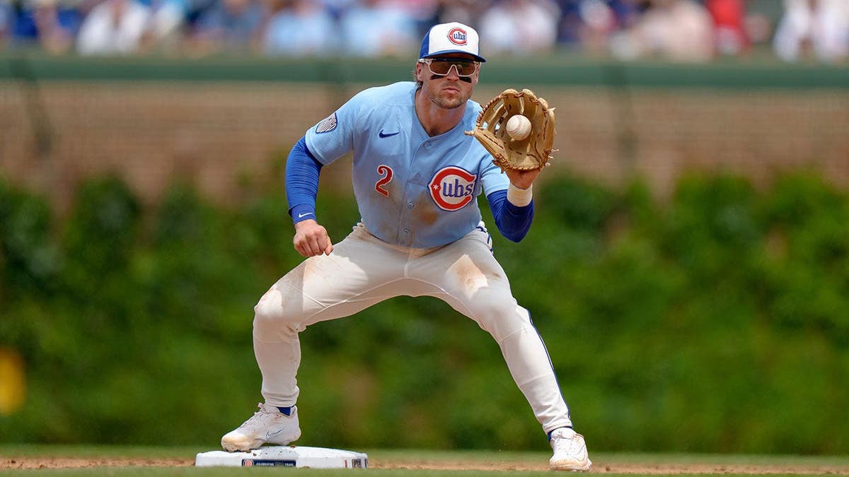 Nico Hoerner making a play at second base at Wrigley Field in Chicago