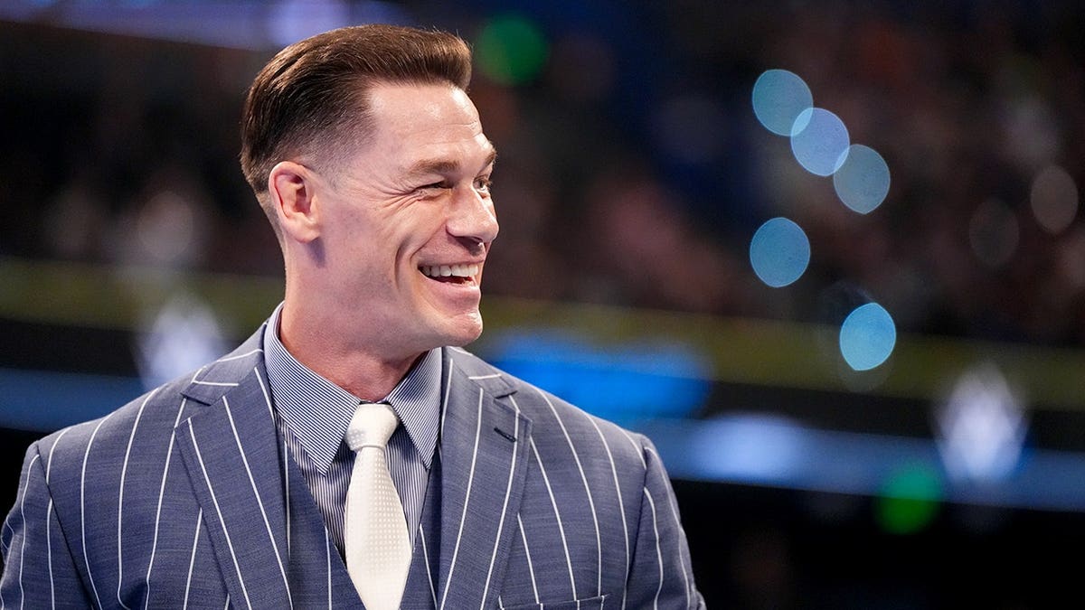 John Cena smiling during WWE Backlash event in Tampa, Florida