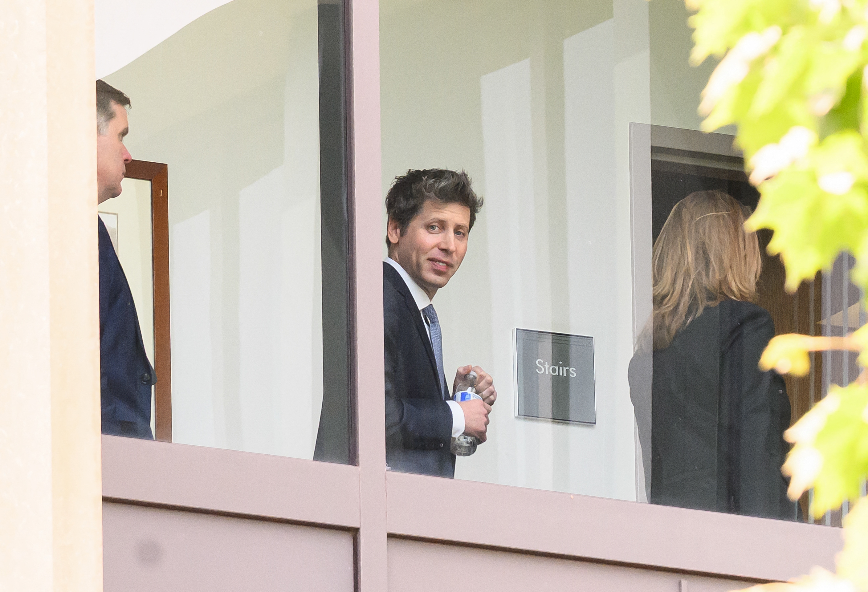 OpenAI CEO Sam Altman walks inside the federal courthouse during a recess in the proceedings in the trial over Elon Musk