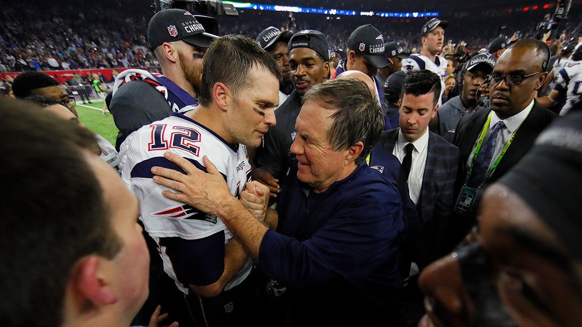 Tom Brady celebrating with head coach Bill Belichick at NRG Stadium