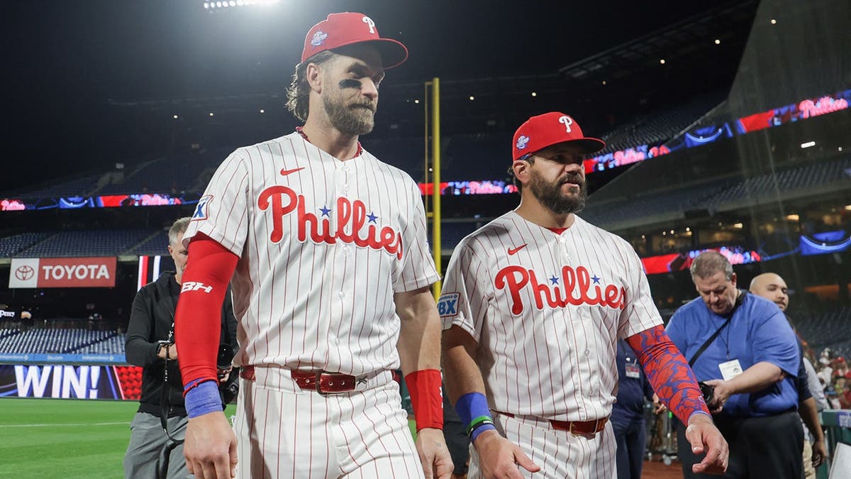 Bryce Harper and Kyle Schwarber walking off the field after a game