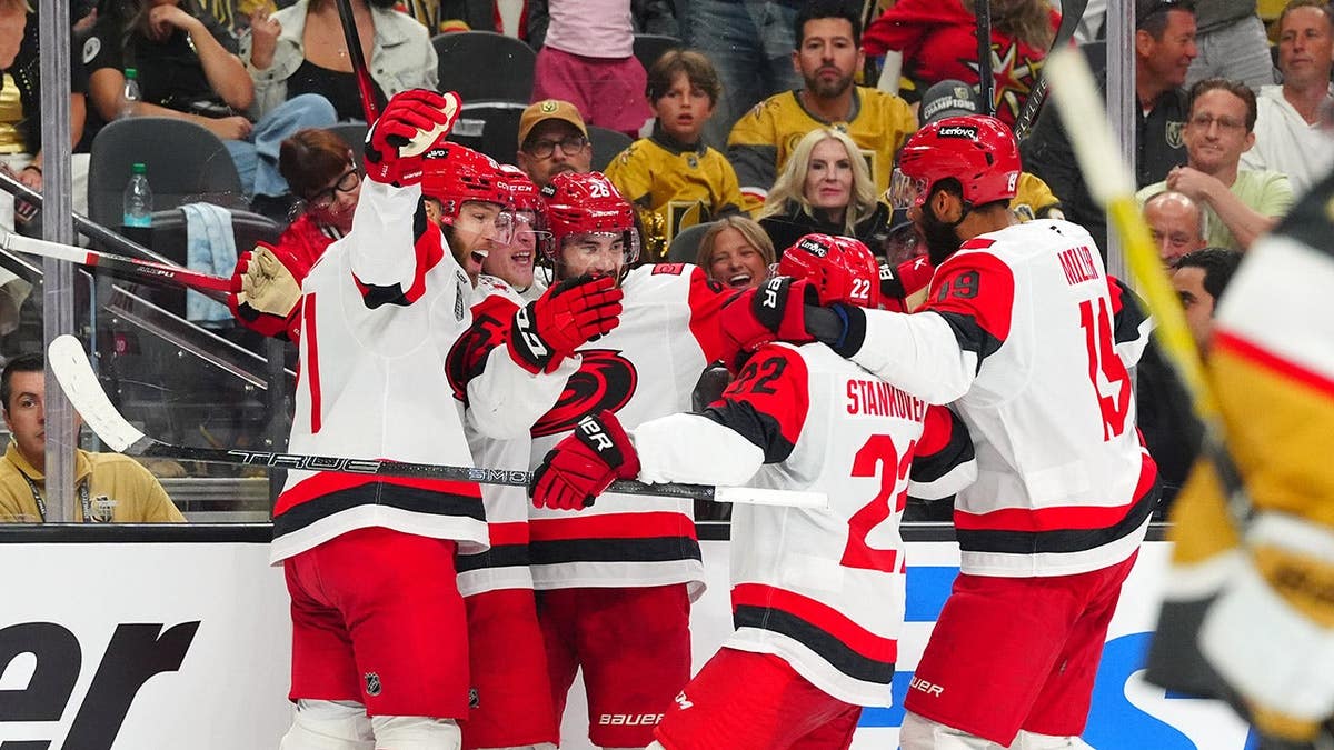 Jackson Blake of the Carolina Hurricanes celebrates with teammates after scoring a goal during NHL Stanley Cup Final game.
