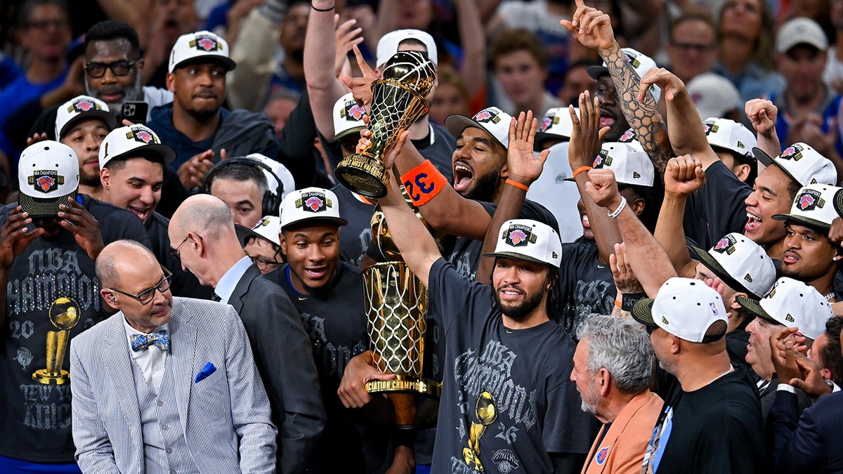 New York Knicks celebrate with the Larry O'Brien Championship Trophy