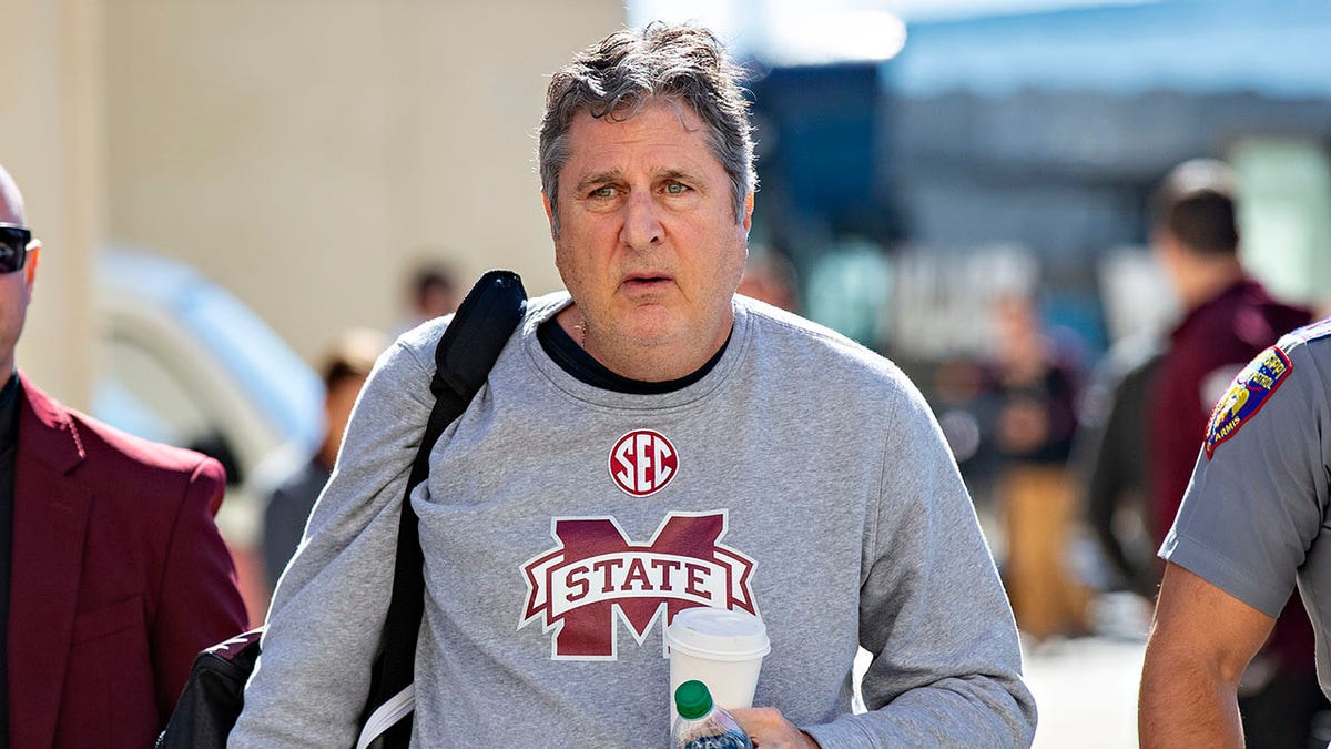 Mike Leach arriving at Donald W. Reynolds Razorback Stadium