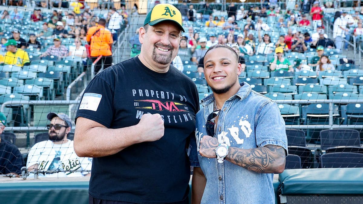KC Navarro and Tommy Dreamer posing for a photo at Sutter Health Park in Sacramento