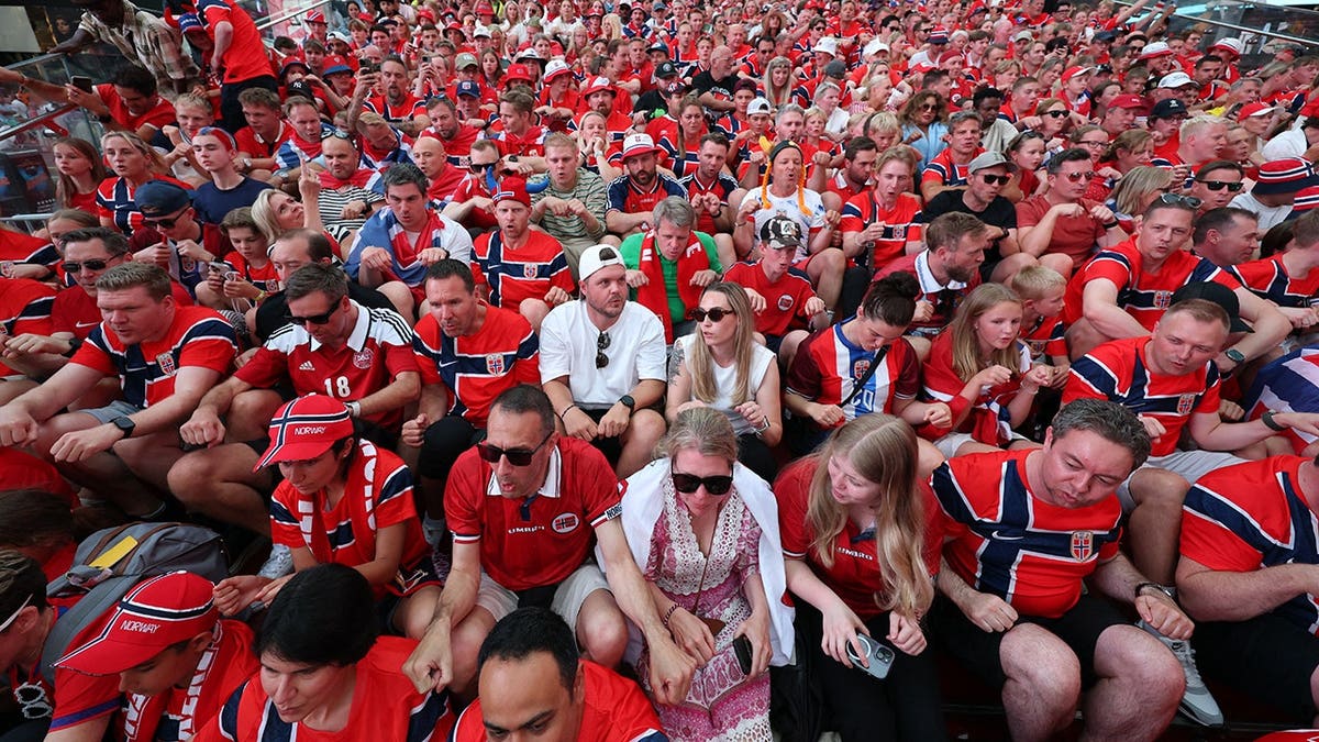 Norway fans performing the Viking row in Times Square New York