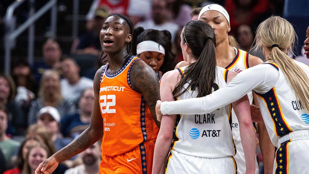 Saniya Rivers and Caitlin Clark argue during a WNBA game at Gainbridge Fieldhouse.
