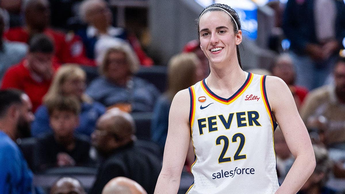 Caitlin Clark stands on the court during an Indiana Fever game against the Connecticut Sun.