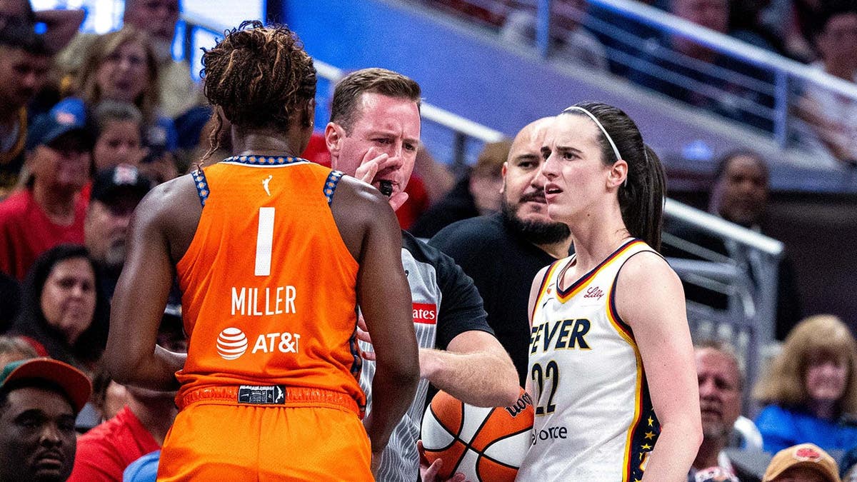 Diamond Miller and Caitlin Clark during a WNBA game at Gainbridge Fieldhouse.