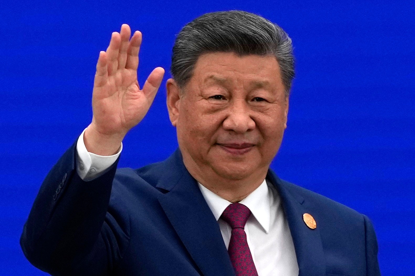 Chinese President Xi Jinping waves as he arrives at the opening ceremony for the World AI Conference in Shanghai, Friday, July 17, 2026.