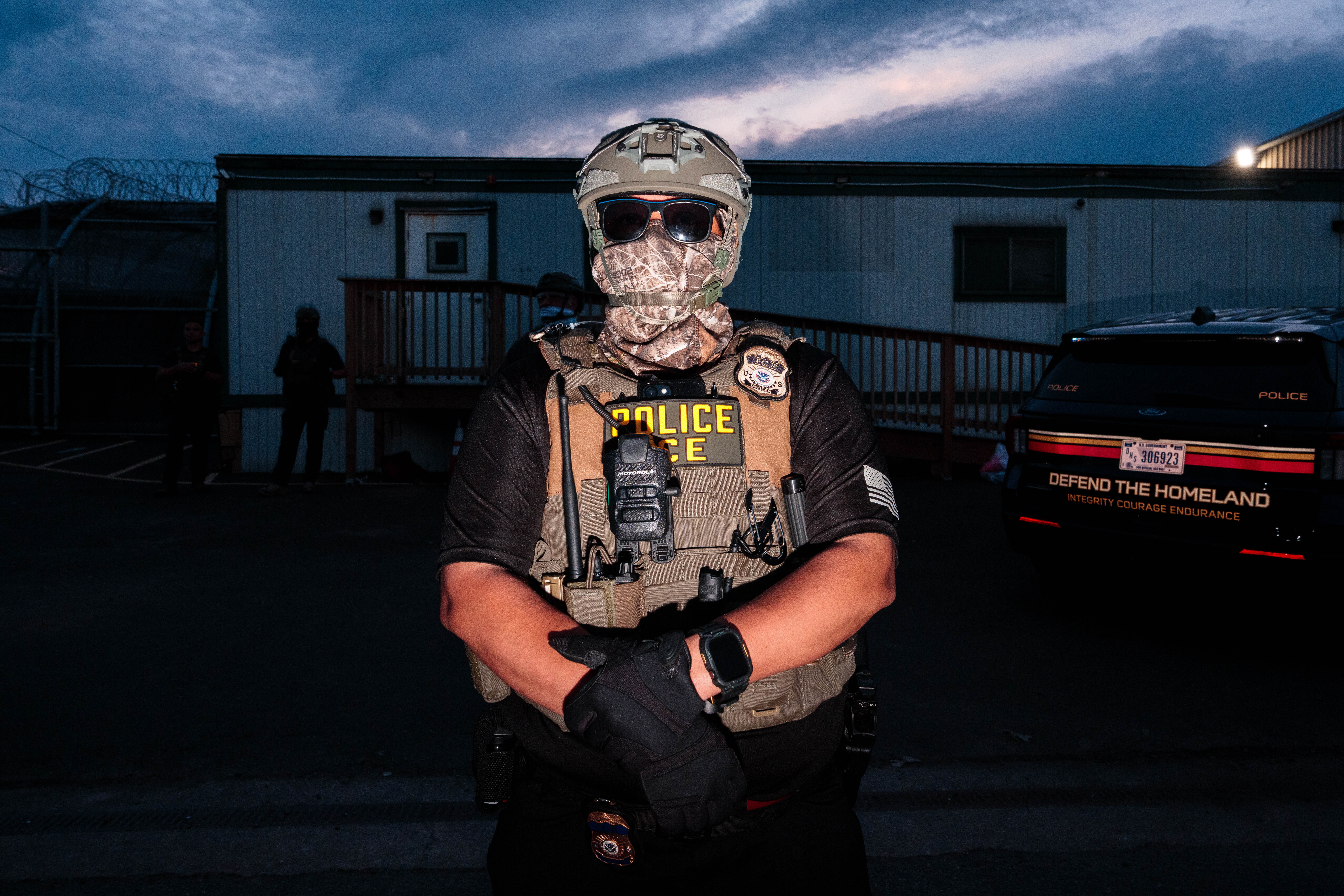 ICE agents stand guard outside a immigrant detention center in Newark, New Jersey in May 2026. Medicaid officials improperly shared data about millions of people with ICE, who then shared that data with the data analytics firm Palantir, according to new court filings.