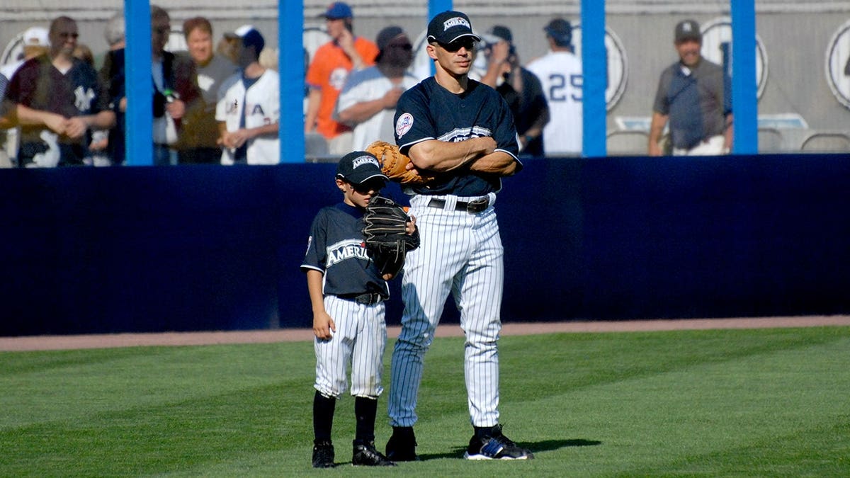 Dante and Joe Girardi stand