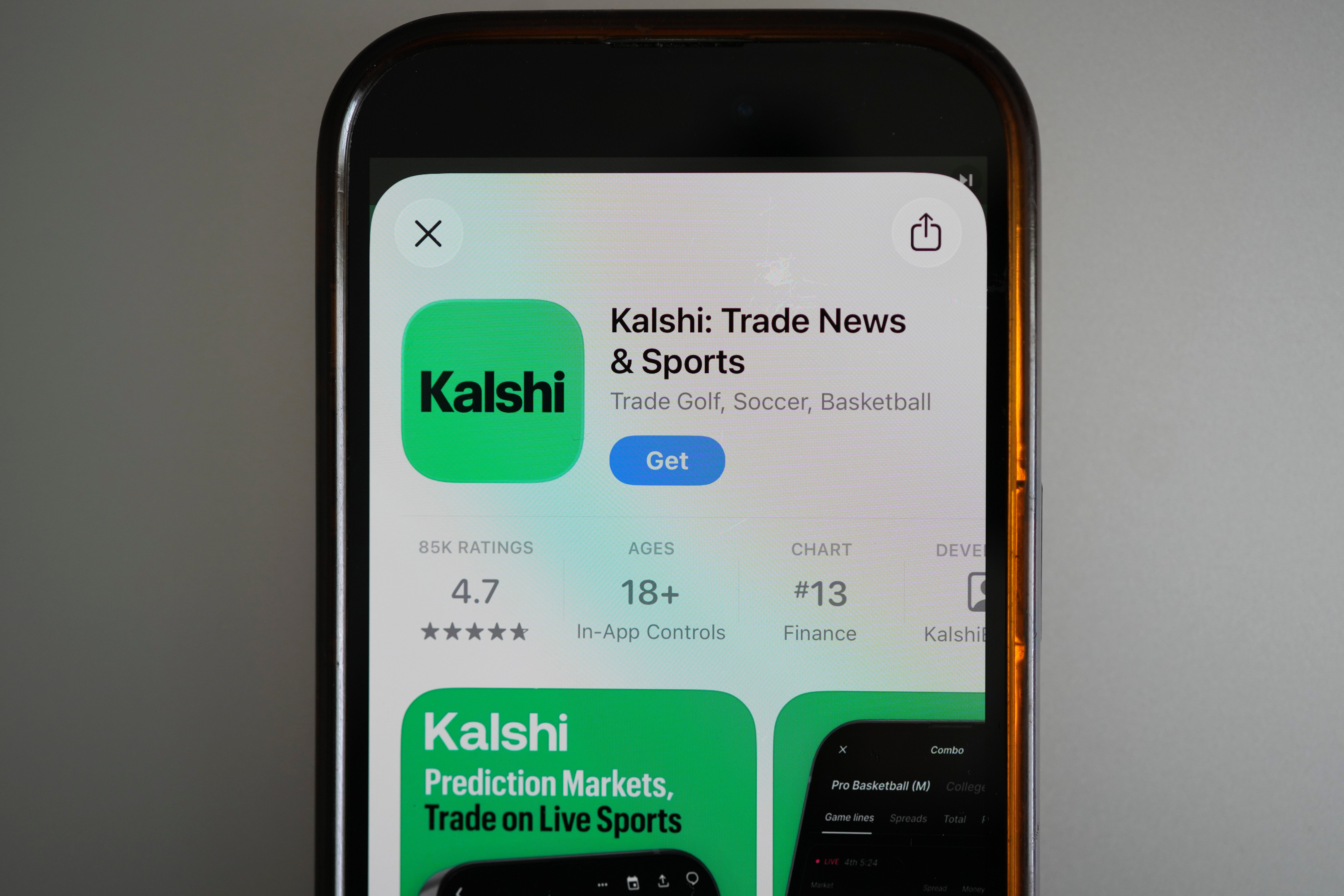 FILE - An ad for the prediction market app Kalshi is displayed on a mobile phone on April 16, 2026, in Chicago. (AP Photo/Erin Hooley, File)