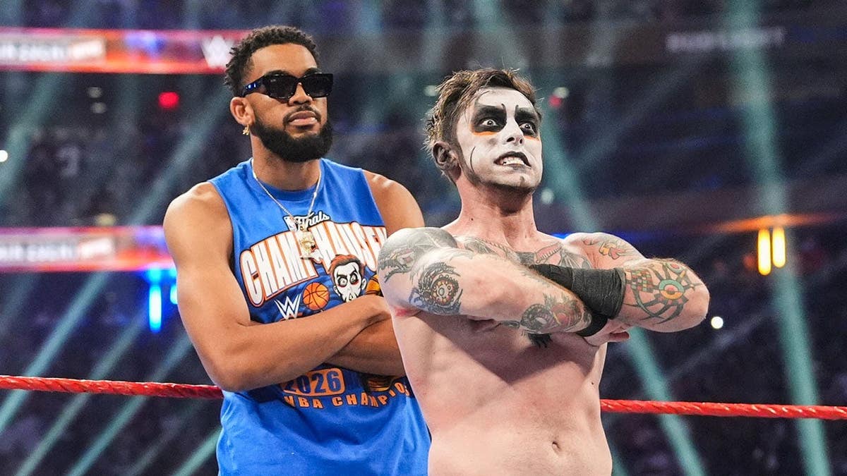 Karl-Anthony Towns and Danhausen look on in the ring at Madison Square Garden.