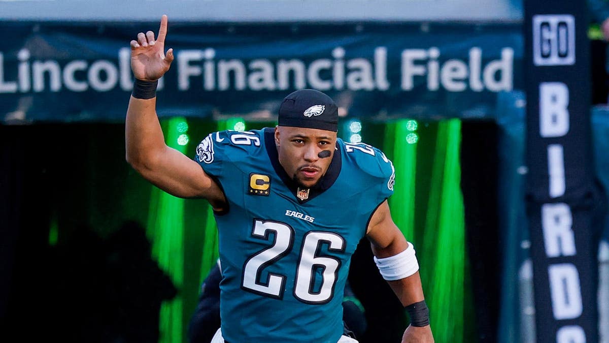 Saquon Barkley #26 takes the field before an NFC Wild Card playoff game.