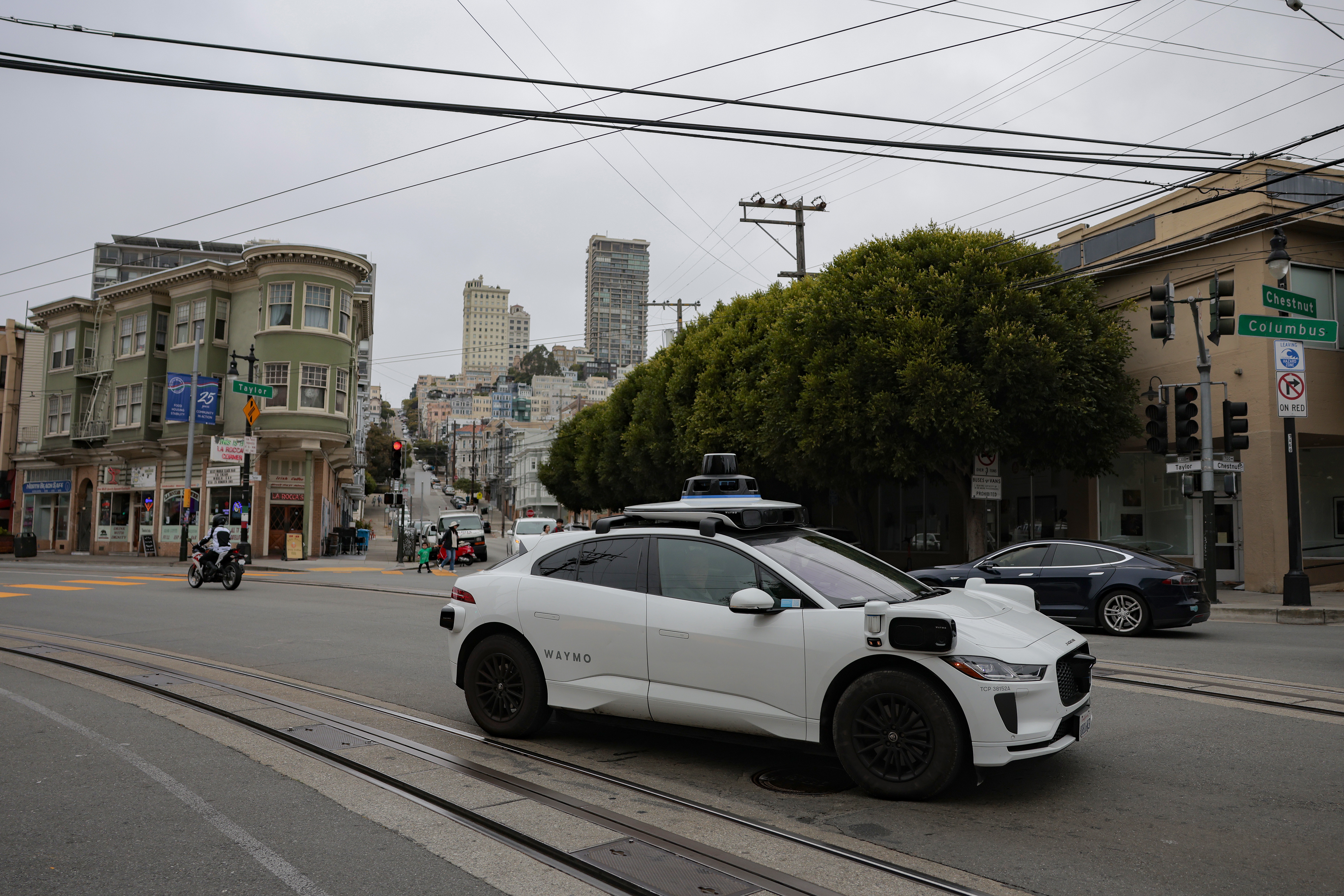A Waymo robotaxi drives in San Francisco