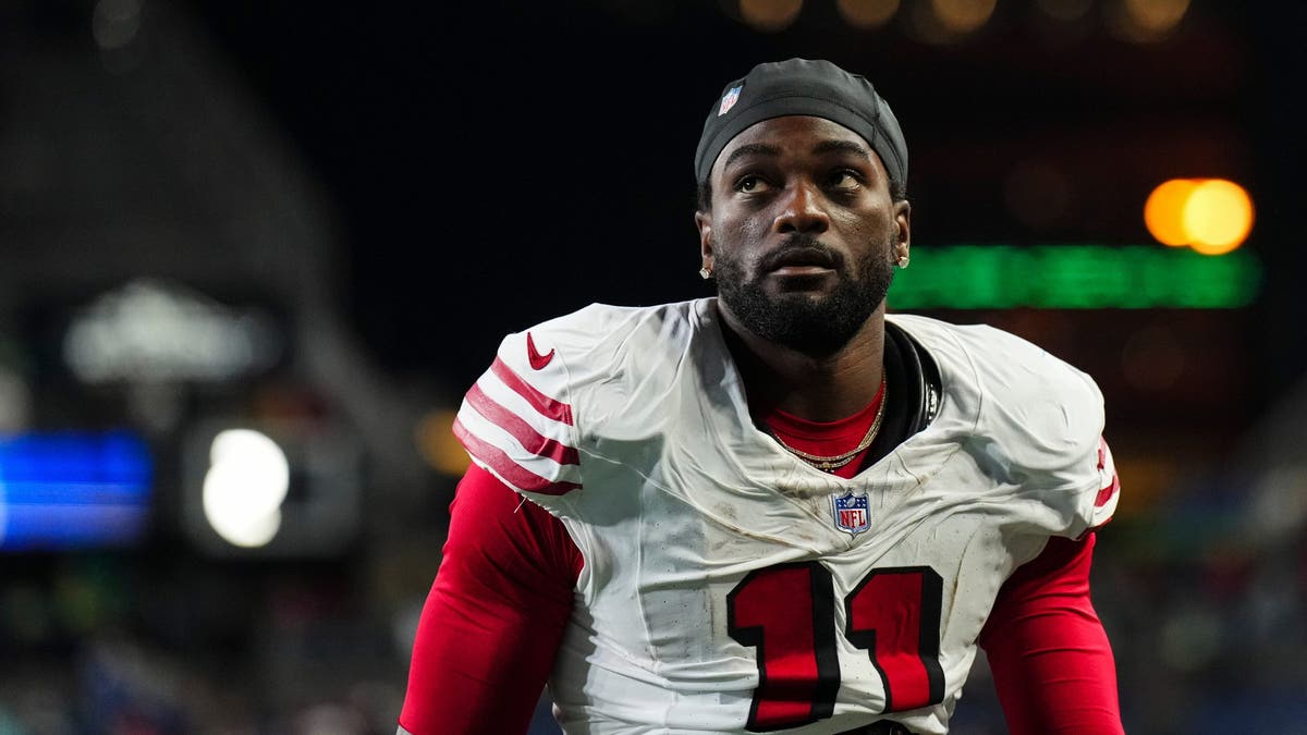 Brandon Aiyuk walks off the field after an NFL game