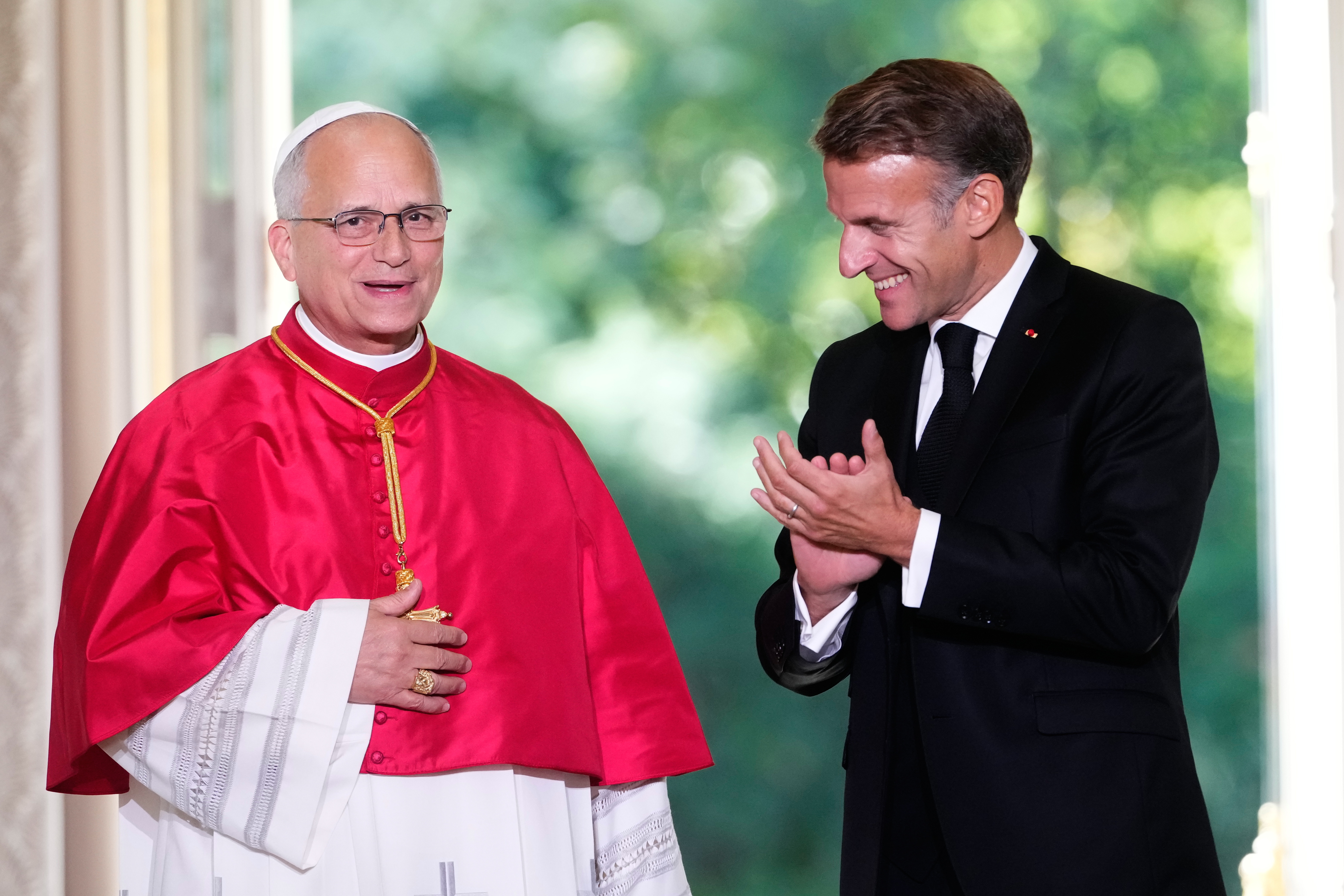 Pope Leo XIV and French President Emmanuel Macron attend a joint statement at the Élysée Palace in Paris, Friday.